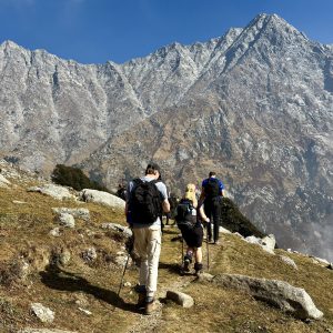 Trekkers hiking in the Dhauladhar mountains near Dharamshala, Himachal Pradesh.
