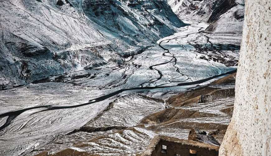 During winter the barren mountains of the Spiti valley get metamorphosed into snowy wonderland. I took this picture while descending from the balcony of Dhankar monastery. Spiti river can be seen meandering below.